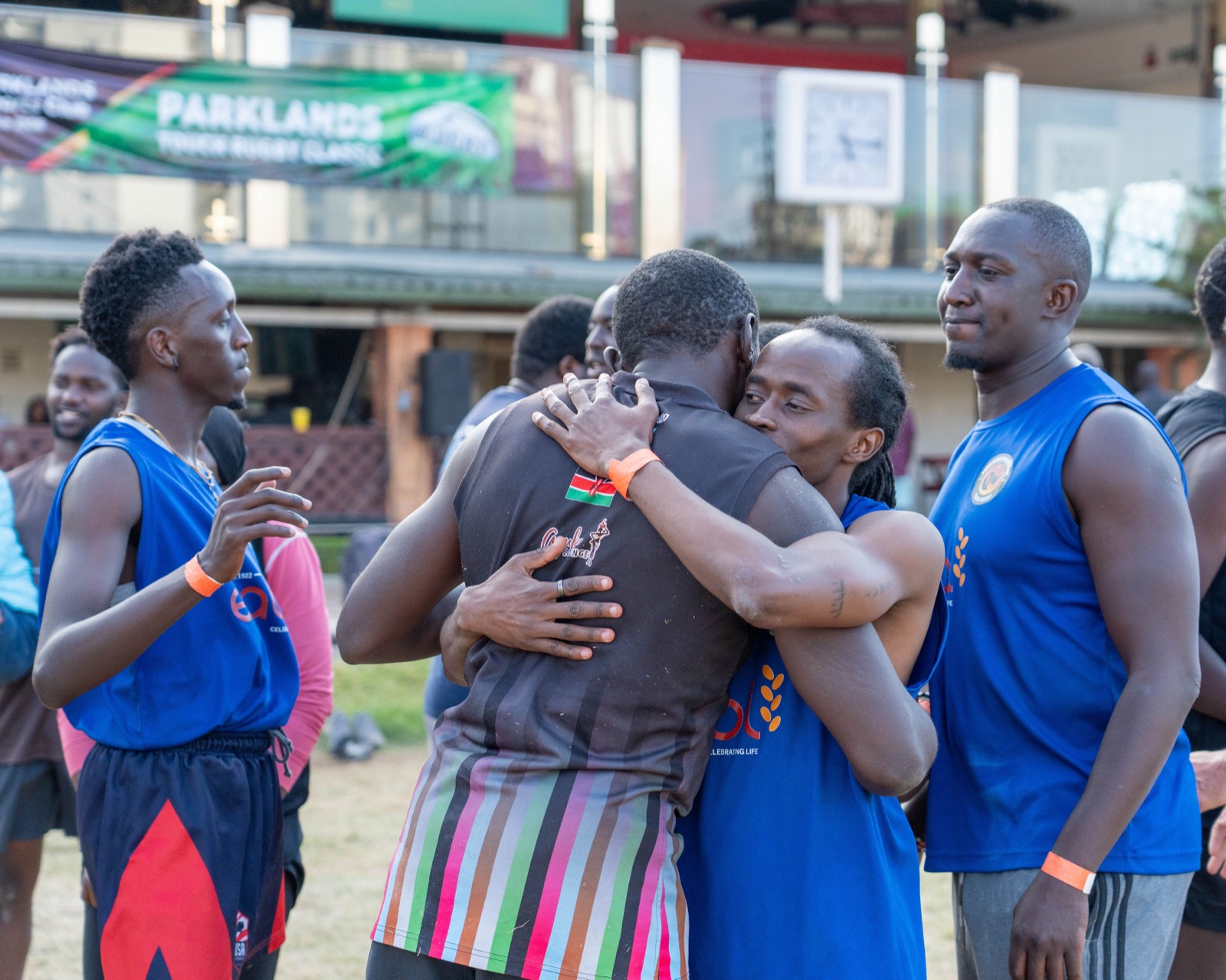 Players embrace after the Grand Final